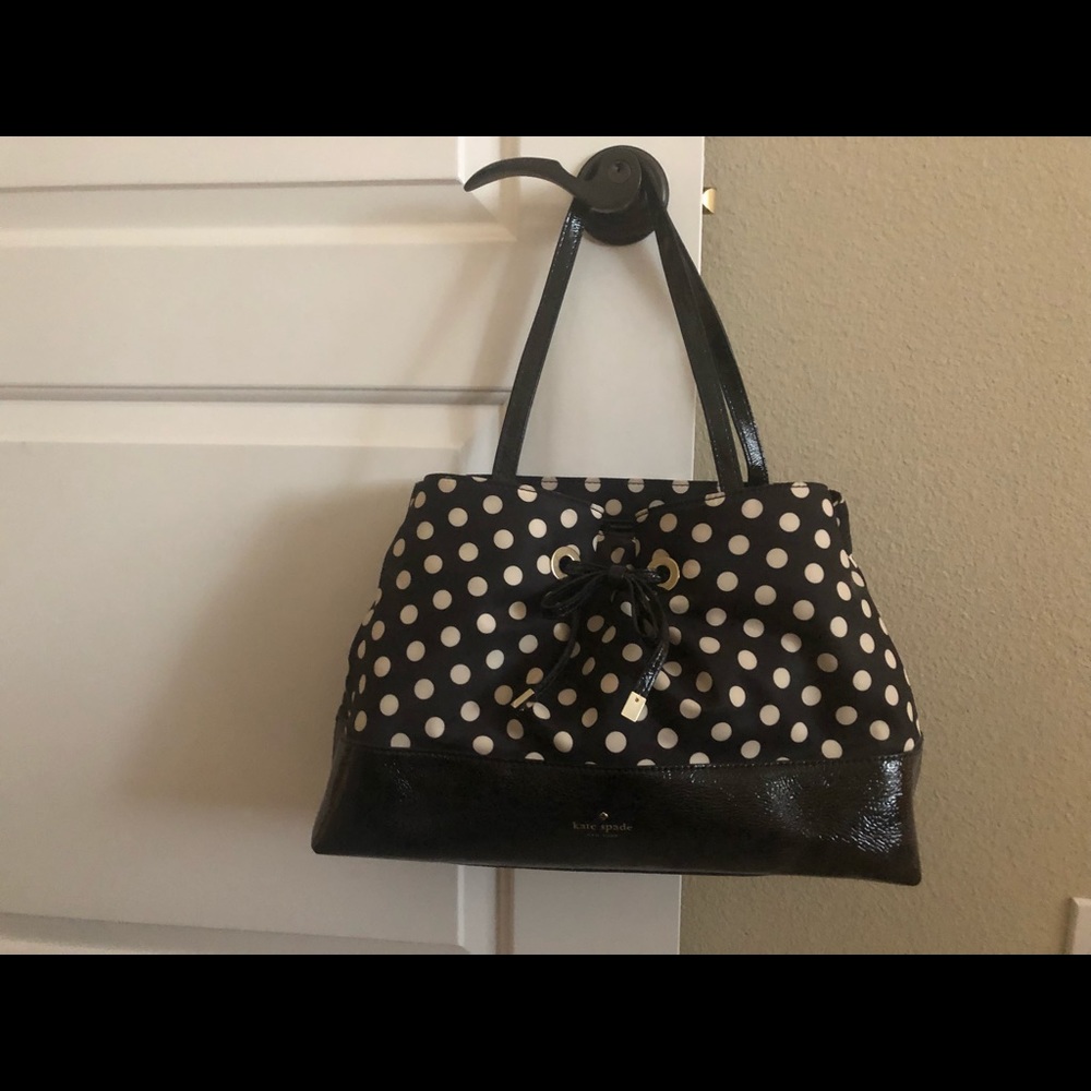 Kate Spade black & white purse with hot pink liner
